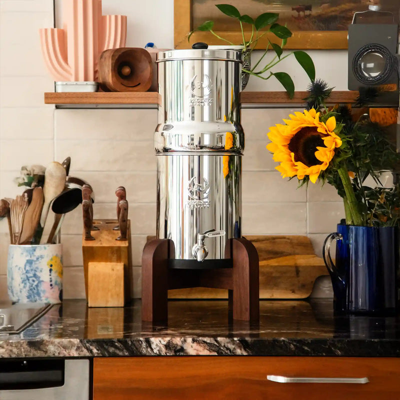 Stainless steel water filter on a kitchen counter with decorative elements